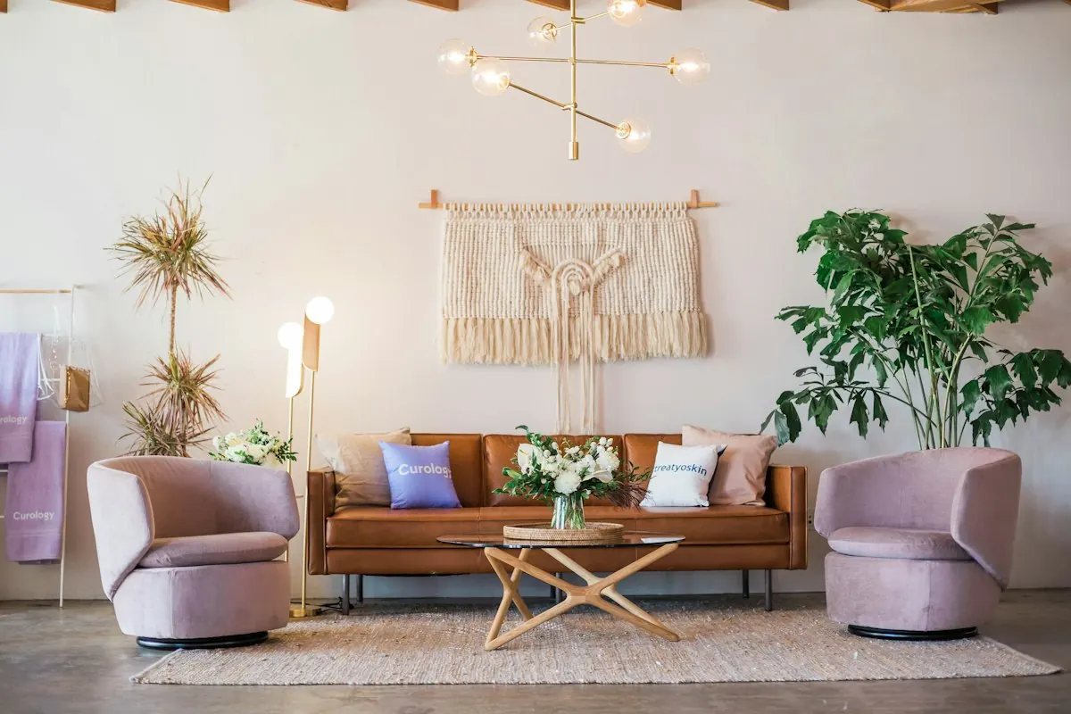 Light-filled living room with a leather sofa and plants