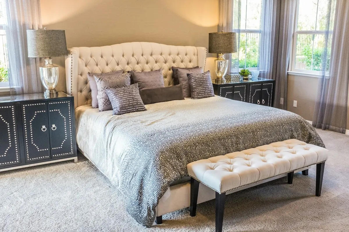 Calm bedroom with an upholstered bed and bench at the foot