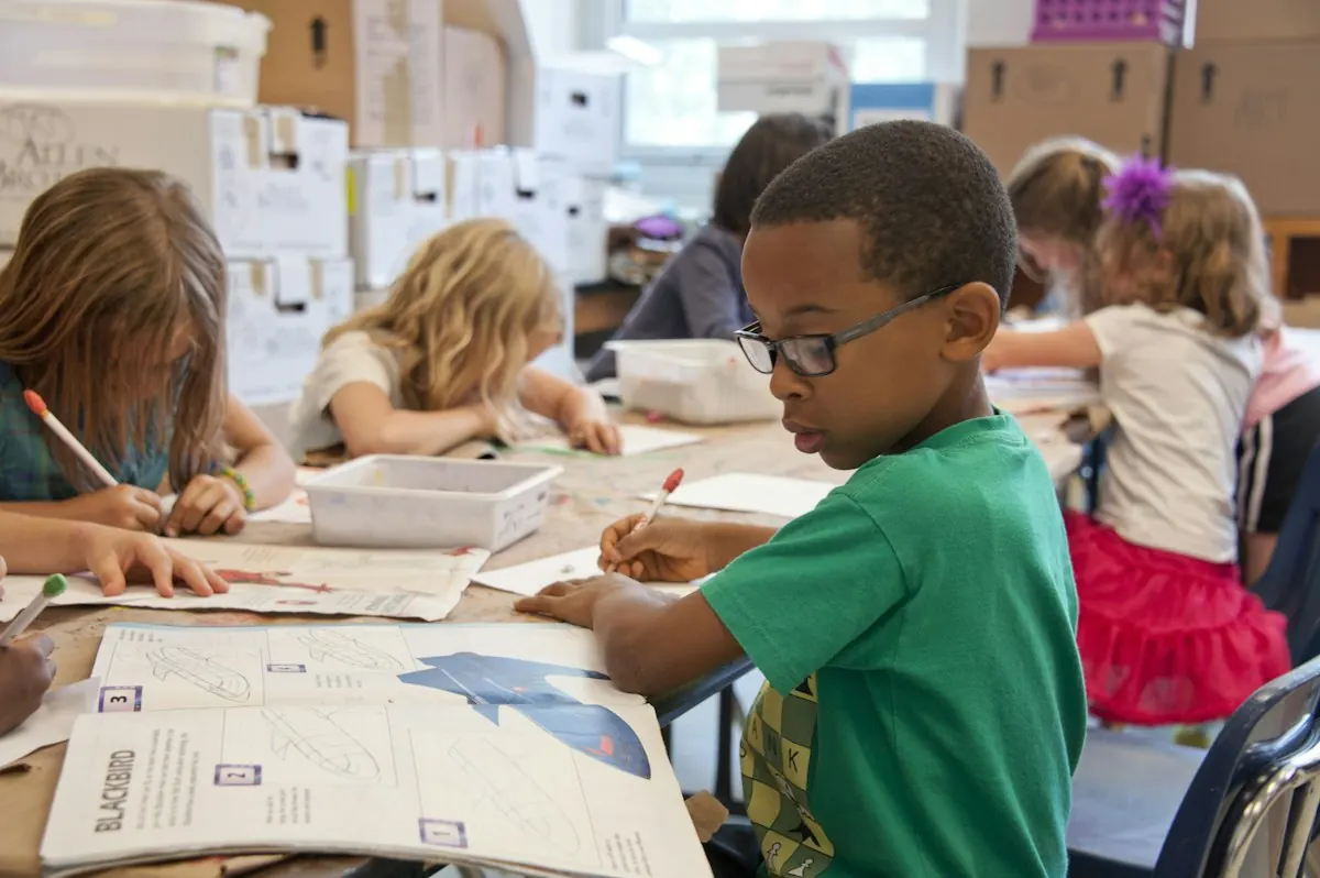 Children working on lessons together at a shared table