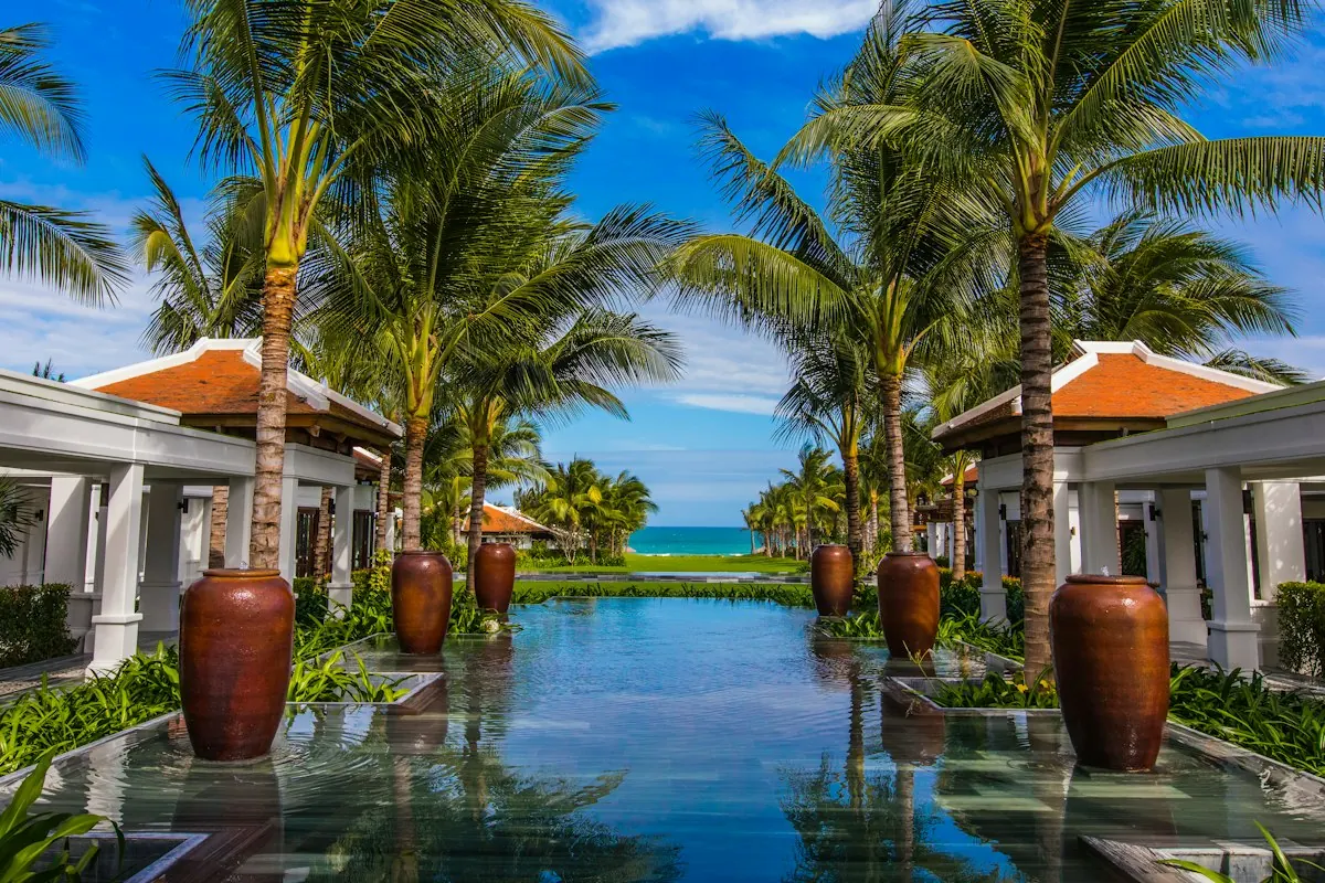 Palm trees around a tropical pool